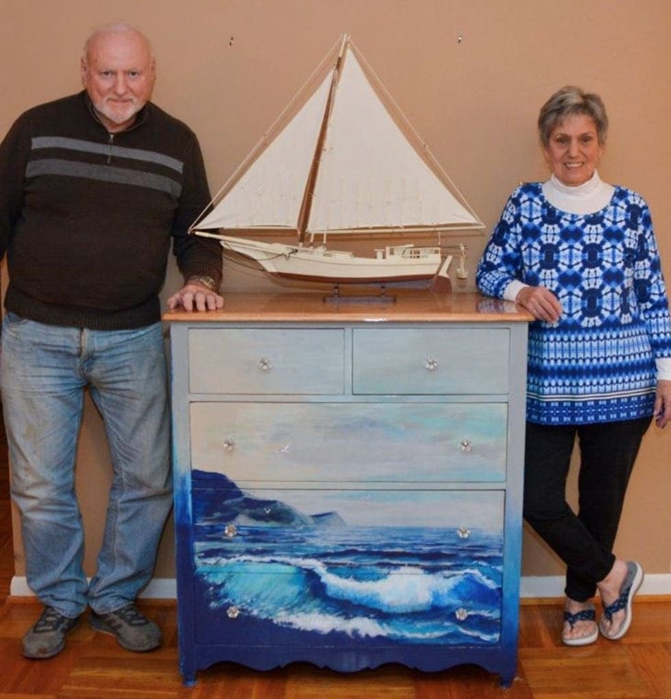 Jerry Becker, a retired Concord High art teacher, and Ruth Govatos show off their sea wave chest.