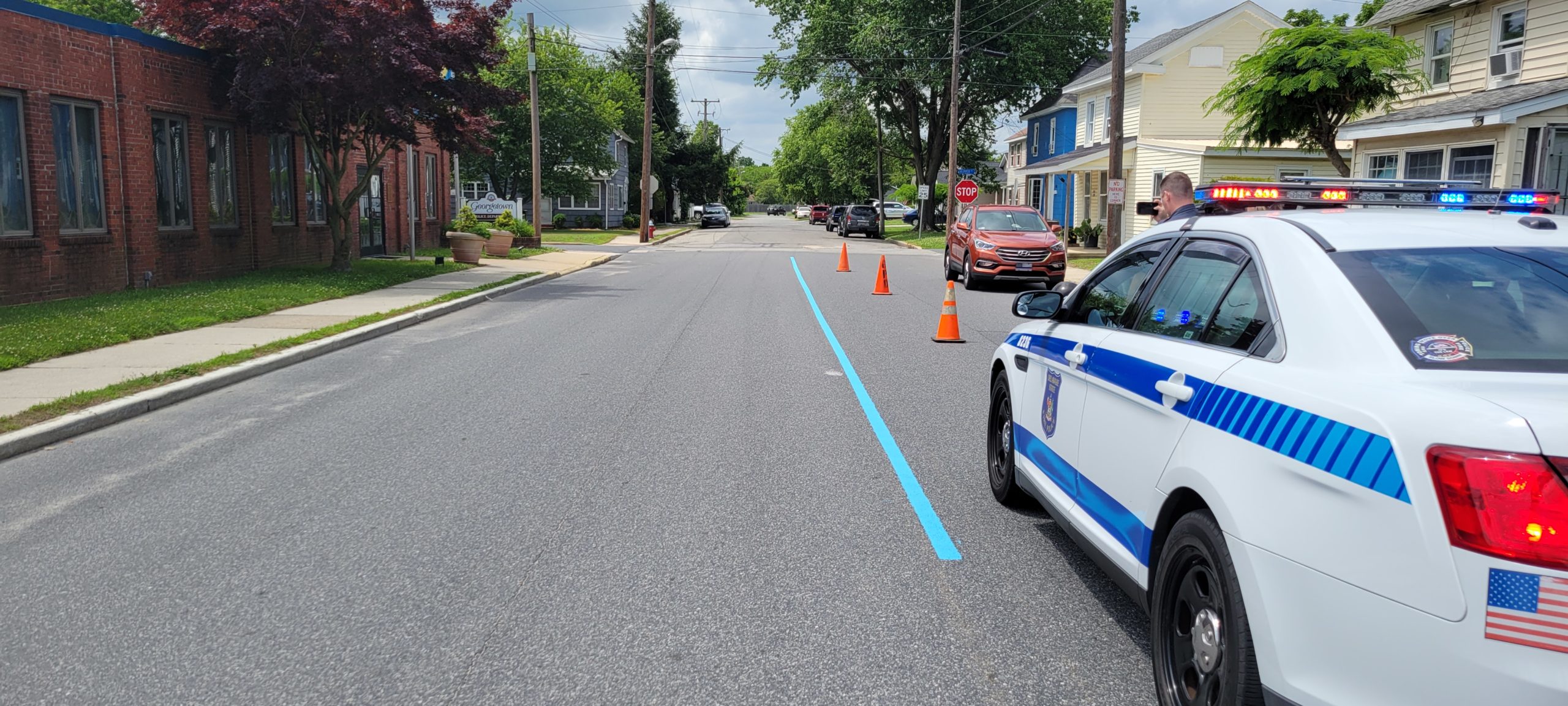 Featured image for “Delaware group paints blue lines in public so police can see support”