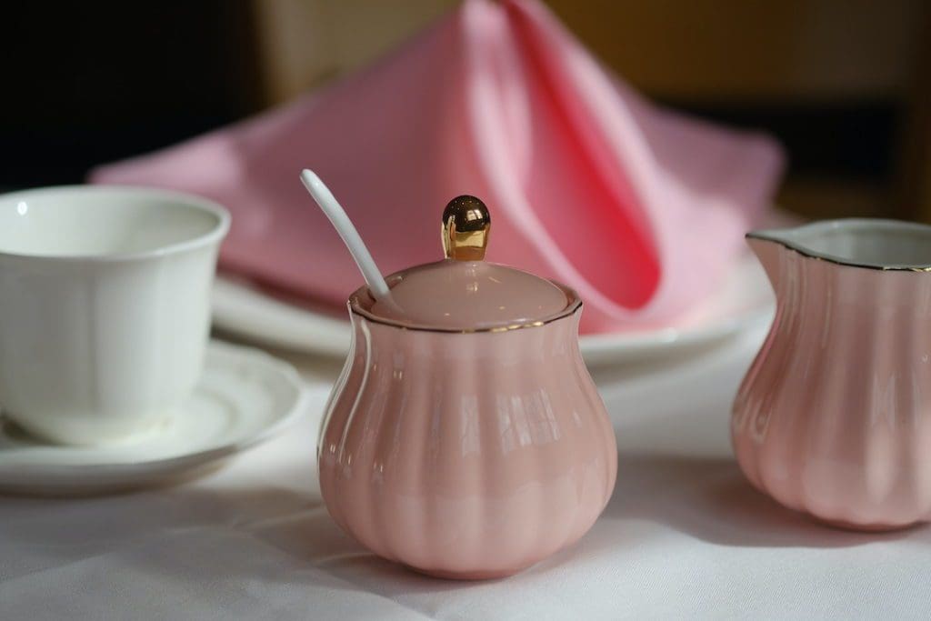 Petal pink napkins, a matching tea set and white china plates set the mood at Kaisy's (Kaisy's Delights)
