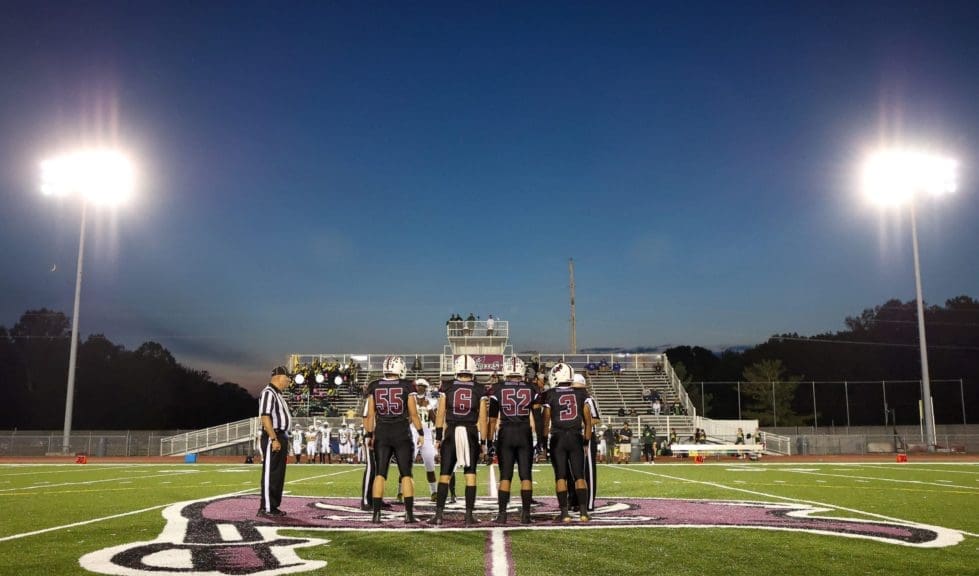 Caravel Football captains during coin flip scaled 2