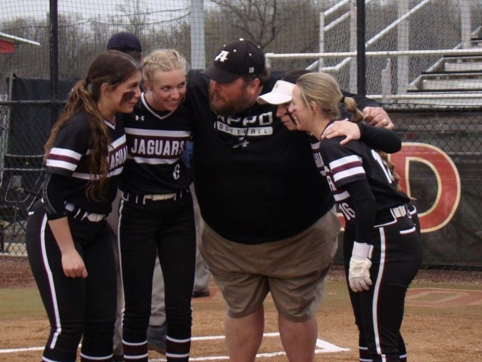 Appoquinimink Coach Brian Timpson huddles with a few players from his team photo courtesy of Appo Softball Instagram 1 1