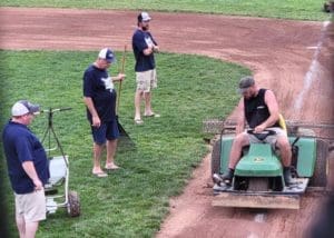 After three nights of heavy rain the Milton field crew readies the field for play photo by Benny Mitchell