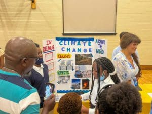 A group of LYTE middle schoolers present their climate change display at this year's showcase.