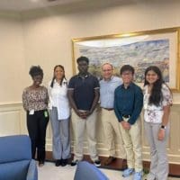From left, Tyasia Cannon, MayEllen Clark, Caleb Odou, Chip Rossi (president of Bank of America Delaware), Timothy Nguyen, Samhitha Vallury.