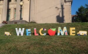 A welcome sign stands in front of Ursuline Academy as lower school students return to class.
