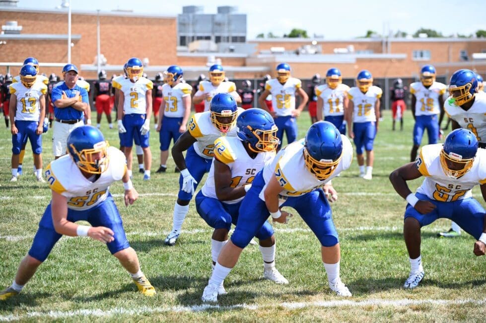 Sussex Central running warmup plays before their game against William Penn photo by Nick Halliday