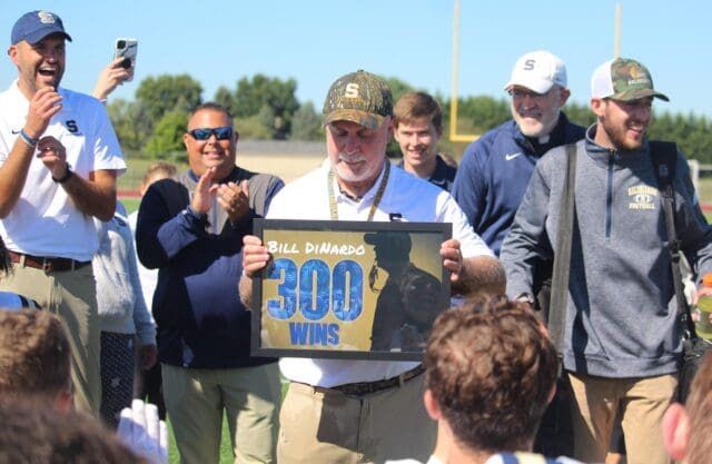 Coach Bill DiNardo receives a plaque after winning his 300th career game photo courtesy of Mike Lang of the Dialogue