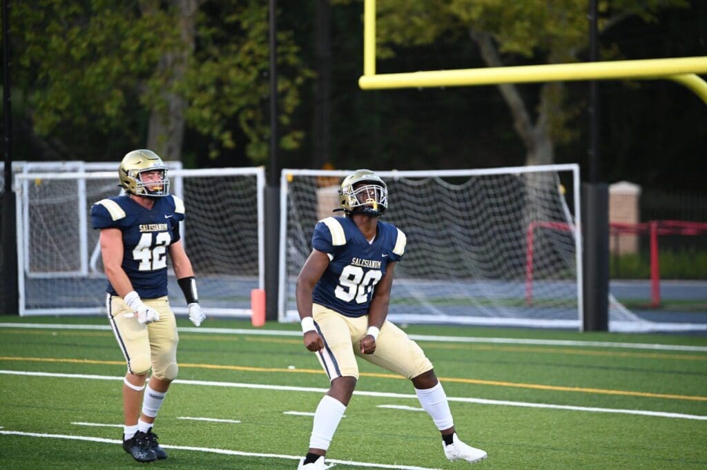 Salesianum Football players RJ Johnson 90 and Trevor Way 42 celebrate photo by Nick Halliday