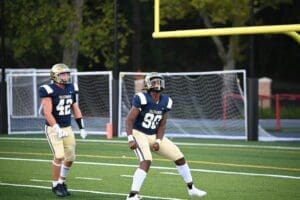 Salesianum Football players RJ Johnson 90 and Trevor Way 42 celebrate photo by Nick Halliday