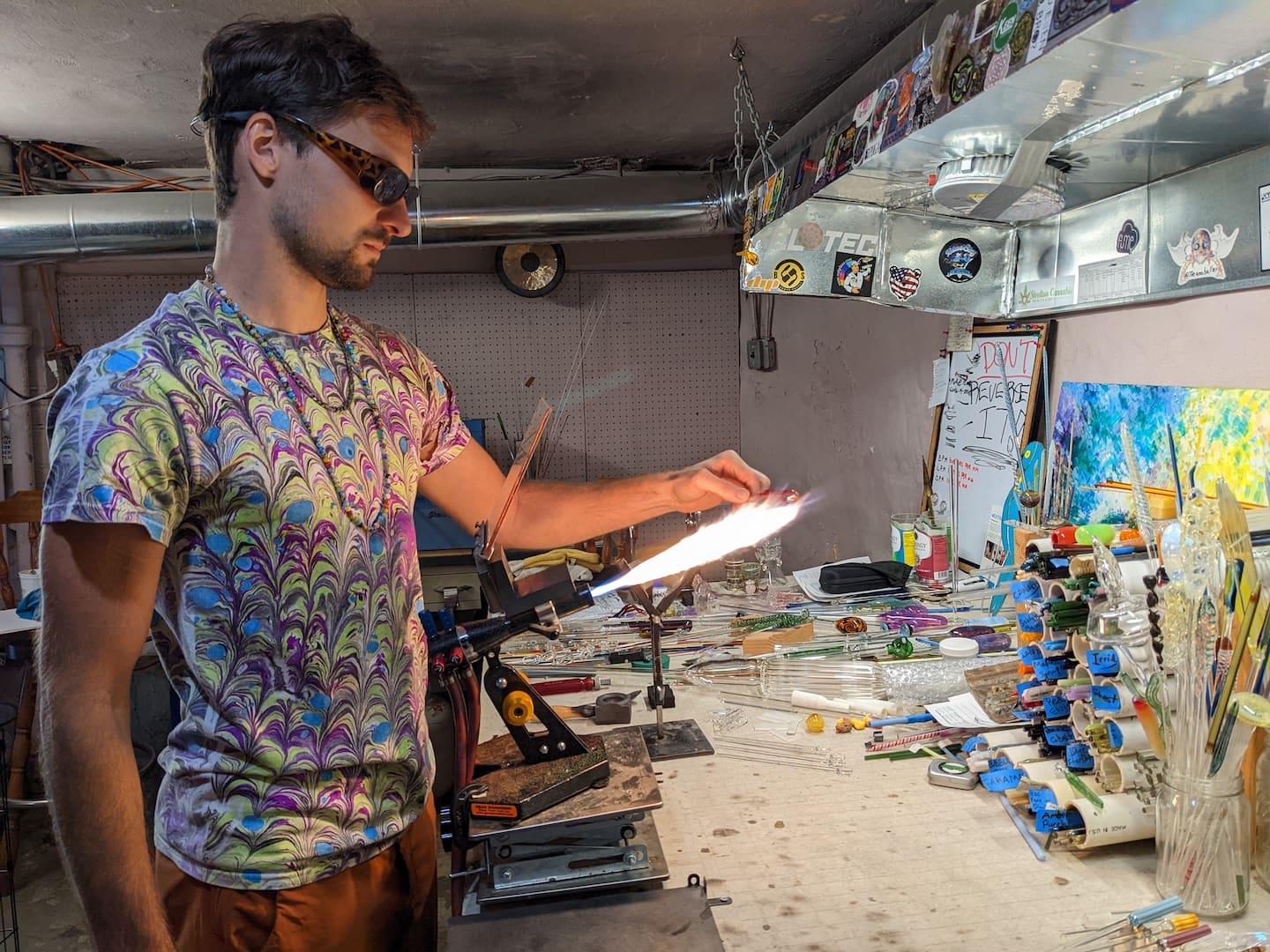 Losco in his Wilmington home studio. He and his partner avidly support the arts: He’s wearing a handmade T-shirt and necklace. (Ken Mammarella photo)