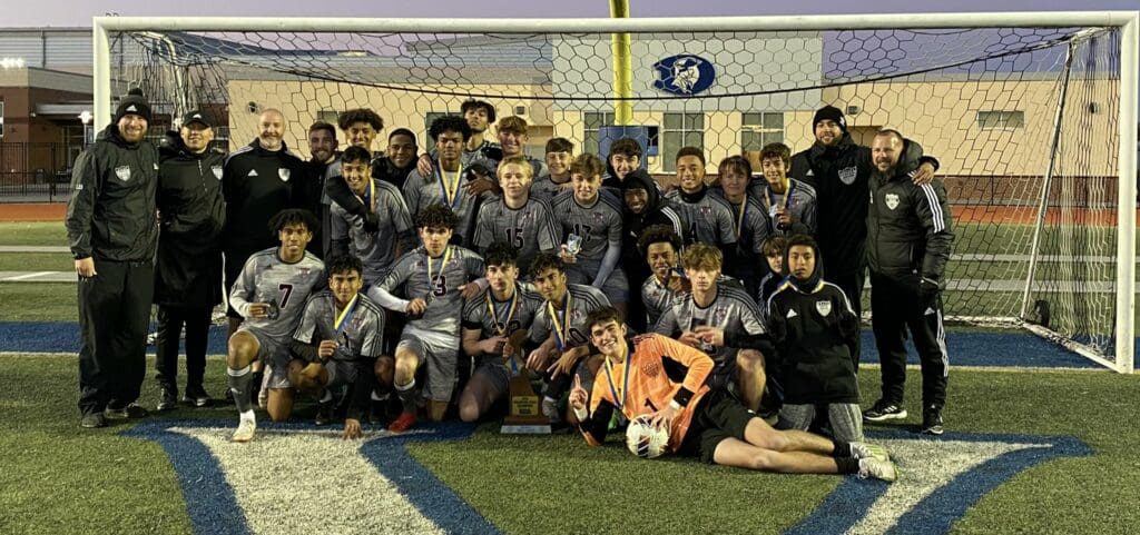 Caravel Boys Soccer team posing with the state championship trophy photo courtesy of Caravel twitter page