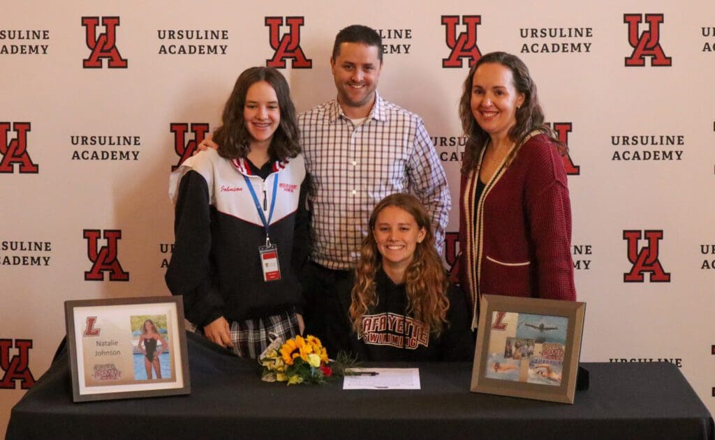 Natalie Johnson joined by her family after signing on to swim at Lafayette College. (Jarek Rutz/Delaware LIVE News)