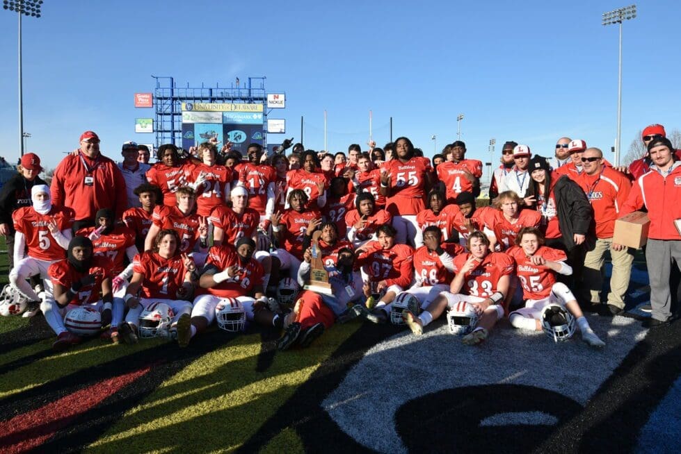 Laurel Football team poses with the statechampionship trophy for second year in a row photo by Ben Fulton 1