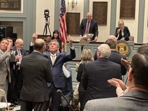 Jobs State of the State Gov. John Carney arrives in the Senate Chamber and signals to friends and family in the balcony