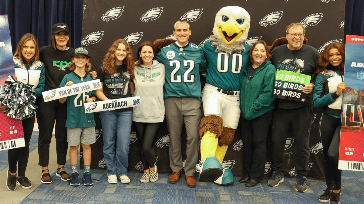 Matt Auerbach and his family with Eagles cheerleaders and mascot Swoop. (Brandywine School District)