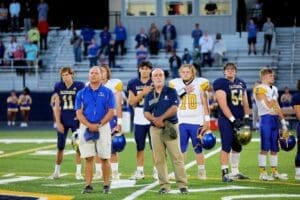 Coach John Wells of Sussex Central Left stands next to Salesianum head football coach Bill DiNardo Right photo courtesy of Salesianum