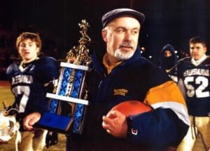 Salesianum head football coach Bill DiNardo holding the 2005 state championship trophy photo courtesy of Salesianum