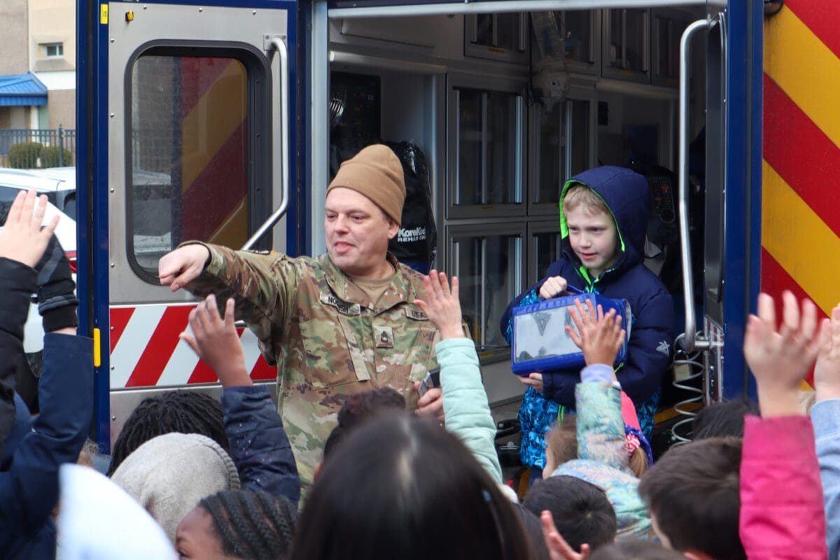 Ursuline students excitedly hopped into the military ambulance during a demonstration that celebrated Catholic Schools Week. (Jarek Rutz/Delaware LIVE News)