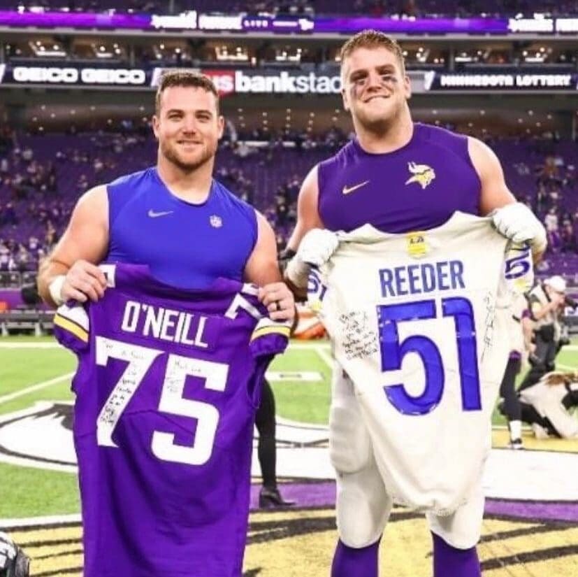Troy Reeder left and Brian Brian ONeill right exchange jerseys after playing against each other in the NFL. 1
