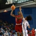 William Penn basketball Emmanuel Vonhm puts upa shot agianst Jameer DeShields from Howard photo by Nick Halliday 2