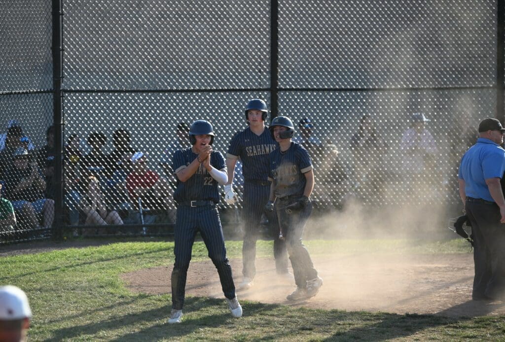 DMA Baseball celebrates at the plat in win over Conrad photo by Nick Halliday