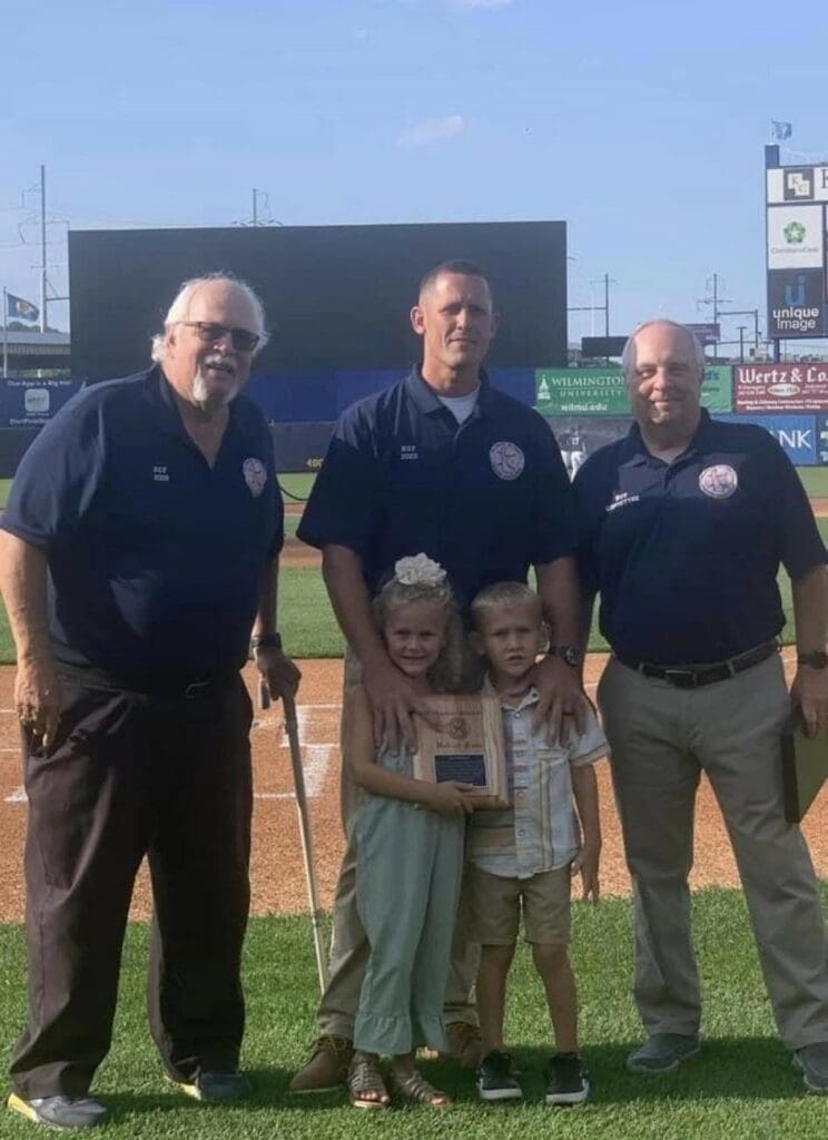 Rob Bryson receiving his Hall of Fame plaque with his kids photo courtesy of Rob Bryson 1