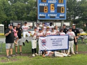 Naamans Little League Majors wins District 2 championship as they pose with the banner after the win photo by Nick Halliday