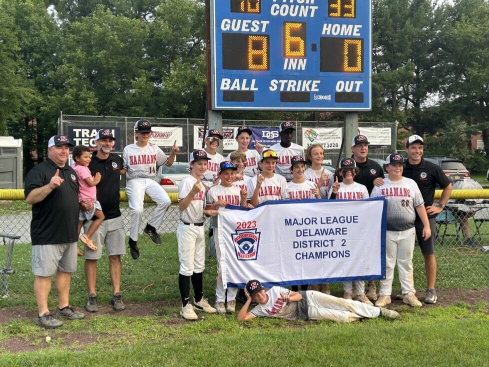 Naamans Little League Majors wins District 2 championship as they pose with the banner after the win photo by Nick Halliday