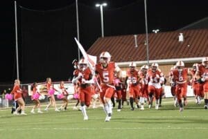 Smyrna football running out before a game photo courtesy of Ben Fulton