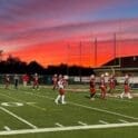 Smyrna football team warming up before a game photo courtesy of Delaware Live