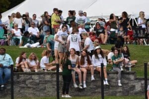 Archmere students line on the wall and the hill to cheer on the team photo by Nick Halliday