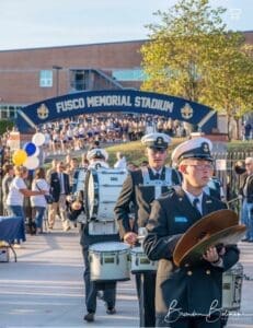 The DMA Band Cheerleaders and Football team entering fusco stadium before a football game photo courtesy of Brandan Bolinski photography