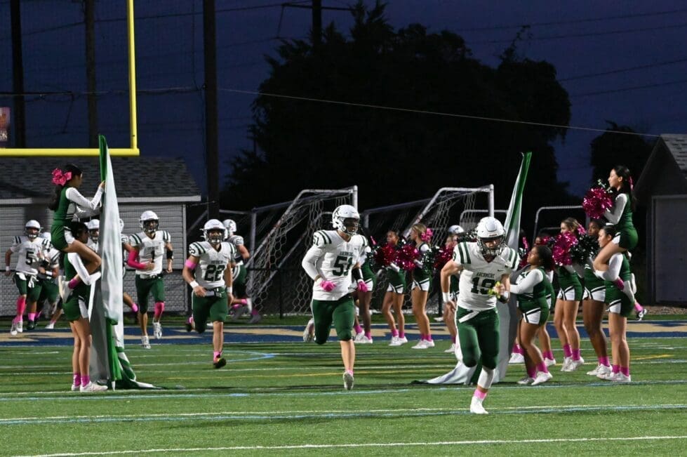 Archmere football team runs out before their game against DMA photo courtesy of Nick Halliday