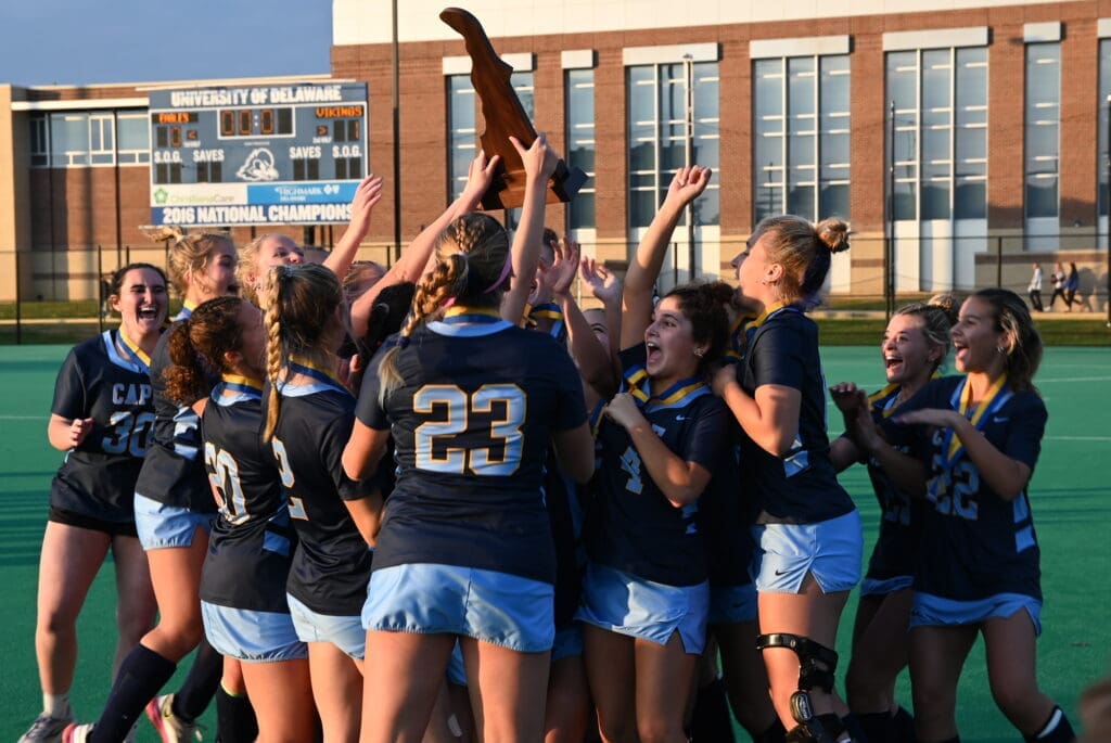 Cape Henlopen field hockey team celebrates being handed the championship trophy photo couresy of Nick Halliday