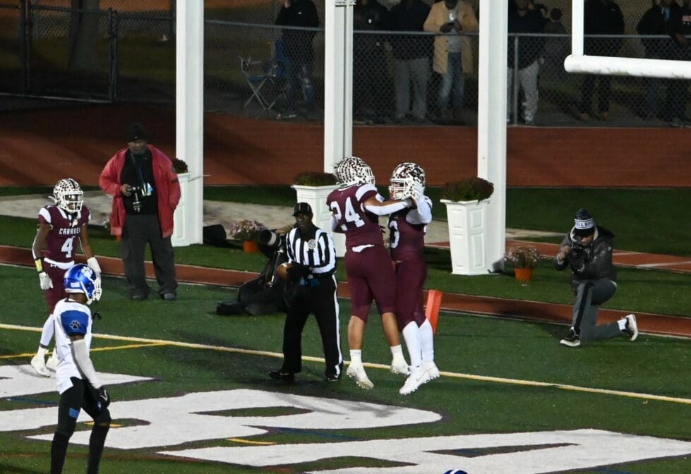 Caravel football Ira Yates and Brock Rhoades celebrate after a touchdown photo courtesy of Nick Halliday
