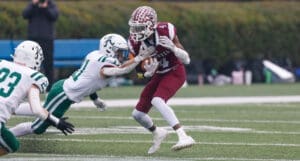 Caravel football Vandrick Trey Hamlin runs the ball against Archmere in the DIAA 2A football state championship photo courtesy of Donnell Henriquez