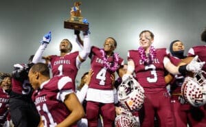 Caravel football poses with the trophy after winning the DIAA 2A football state championship photo courtesy of Donnell Henriquez