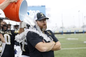 Tatnall football coach Brendon Ireton fets the cooler dumped on him during the DIAA 1A football state championship photo courtesy of Donnell Henriquez