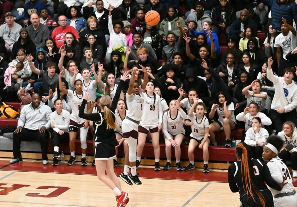 Caravels Chastity Speedy Wilson attempts a three pointer as the crowd behind her started to cheer in their win over Ursuline photo courtesy of Nick Halliday