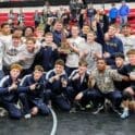 Delaware Military Academy DMA wrestling posing with the division II state championship trophy photo courtesy of DMA Athletics Twitter