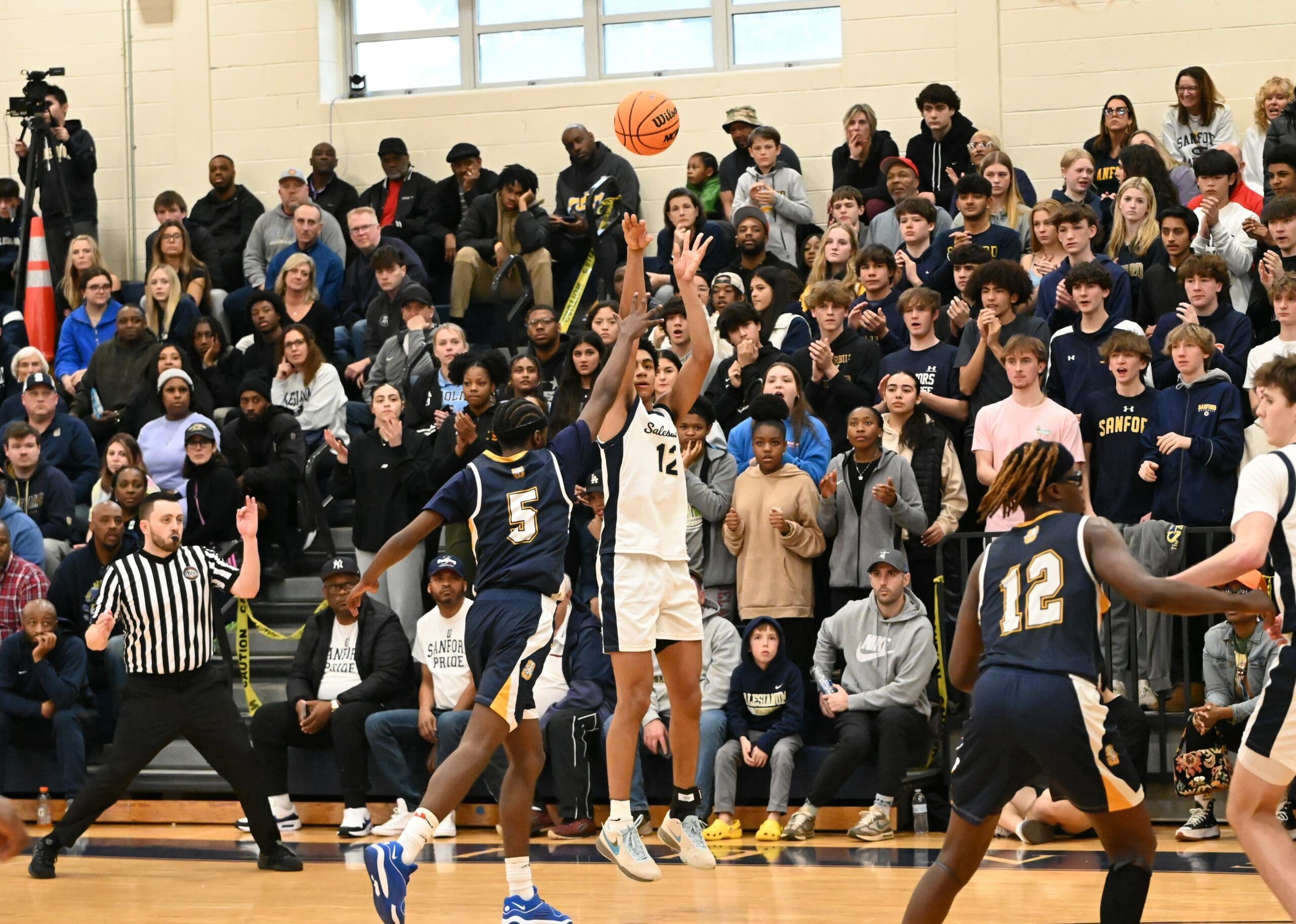 Salesianum boys basketball Justin Hinds attempts a three pointer against Sanford photo courtesy of Nick Halliday scaled