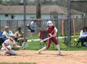 Caravel softball Leah Richardson swings at a pitch. Photo by Nick Halliday