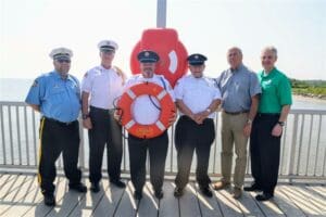 DNREC has released several tips to stay safe while boating, and has launched new life rings at Woodland Beach. (From left: Citizens’ Hose Company members Keith Mapps, Fire Chief Chip Thompson, John Morgan, retired State Senator and board member Bruce C. Ennis, DNREC Division of Fish and Wildlife Director Pat Emory and DNREC Secretary Shawn M. Garvin. Photo from DNREC)