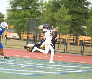 Appoquinimink football Jahsiear Rogers catches a touchdown pass in their win over Dover. Photo by Ben Futon