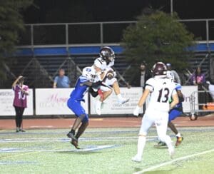 Appoquinimink football Noah Hoff catches a touchdown pass in their win over Dover. Photo by Ben Futon