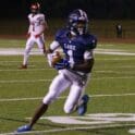 Darius Miller of Lake Forest makes the catch turns and runs for a gain on Friday night against Red Lion. Photo by DarJuan Pitts
