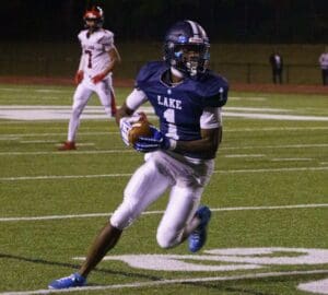Darius Miller of Lake Forest makes the catch turns and runs for a gain on Friday night against Red Lion. Photo by DarJuan Pitts