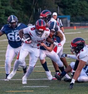 Lake Forests Josiah Torres brings down Red Lions Mehki Corbin near the goal line. Photo by DarJaun Pitts