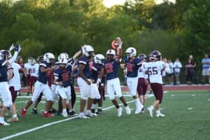 Newark Charter Football Ajay Bonis comes up with the fumble. Photo by Nick Halliday