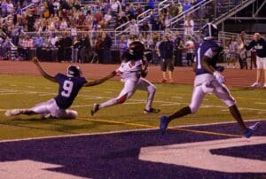 Raheem Spencer of Red Lion escapes the grasp of Damien Brewington of Lake Forest for a touchdown in overtime. Photo by DarJuan Pitts